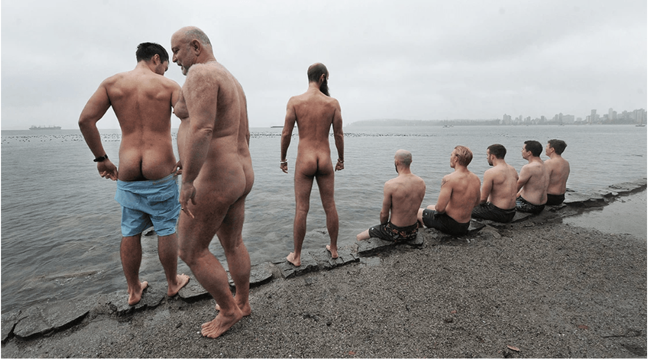 Will Blunderfield leading men in a naked cold plunge at Trafalgar Street Beach, Vancouver.